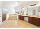 Bright bathroom featuring a garden tub, walk-in shower, double vanity, and neutral tile flooring at 343 Leslie Ln, Lake Mary, FL 32746