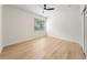 Well-lit bedroom with laminate flooring, ceiling fan, and bright window at 343 Leslie Ln, Lake Mary, FL 32746