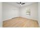 Bright bedroom featuring laminate flooring, a window, and closet with sliding doors at 343 Leslie Ln, Lake Mary, FL 32746