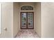 Elegant double front doors with glass panes and brick entryway at 343 Leslie Ln, Lake Mary, FL 32746