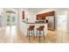 Open kitchen featuring modern appliances and a breakfast bar with seating at 343 Leslie Ln, Lake Mary, FL 32746