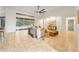 Bright living room with tile flooring, large windows providing natural light, and access to the pool area at 343 Leslie Ln, Lake Mary, FL 32746