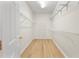 Spacious walk-in closet with wire shelving and laminate flooring for optimal organization at 343 Leslie Ln, Lake Mary, FL 32746
