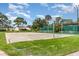 Community basketball court with well-maintained landscaping and nearby tennis court at 3887 Atrium Dr # 3, Orlando, FL 32822