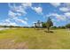 Expansive golf course view with a statue of a golfer, manicured greens, and serene water features at 3887 Atrium Dr # 3, Orlando, FL 32822