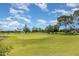 Beautiful golf course with mature trees and landscaping in a serene community setting at 3887 Atrium Dr # 3, Orlando, FL 32822