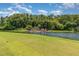 Scenic view of a lush green landscape with the word 'VENTURA' over the lake and trees at 3887 Atrium Dr # 3, Orlando, FL 32822