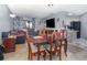 Open concept layout featuring a dining table, living room furniture and galley kitchen perfect for gatherings at 3887 Atrium Dr # 3, Orlando, FL 32822