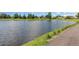 Scenic pond view with lush green surroundings in a serene community at 3887 Atrium Dr # 3, Orlando, FL 32822