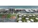 An aerial view of a coastal community boasting multiple buildings, ample parking, and convenient beach access at 4141 S Atlantic Ave # 707, New Smyrna Beach, FL 32169