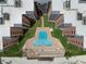 Vacation condos with a pool featuring lounge chairs for sunbathing and relaxation by the beach at 4141 S Atlantic Ave # 707, New Smyrna Beach, FL 32169