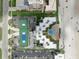 A high angle aerial view of a condo and the tennis courts, pool and beach in Florida at 4141 S Atlantic Ave # 707, New Smyrna Beach, FL 32169
