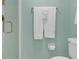 Clean bathroom featuring a toilet, shower, and towel rack with ample space for your convenience at 4141 S Atlantic Ave # 707, New Smyrna Beach, FL 32169