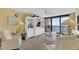Cozy living room with ocean views, comfortable seating, and a decorative entertainment center at 4141 S Atlantic Ave # 707, New Smyrna Beach, FL 32169