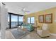 Bright living room featuring ocean views, a comfortable sofa, and tile floors at 4141 S Atlantic Ave # 707, New Smyrna Beach, FL 32169