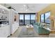 Inviting living room with ocean view balcony, stylish decor, and a comfortable sofa at 4141 S Atlantic Ave # 707, New Smyrna Beach, FL 32169