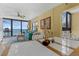Inviting living room with ocean views, balcony access, and comfortable seating arrangement with coastal décor at 4141 S Atlantic Ave # 707, New Smyrna Beach, FL 32169