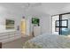 Relaxing main bedroom featuring balcony access, comfortable bed, with dresser and closet for ample storage at 4141 S Atlantic Ave # 707, New Smyrna Beach, FL 32169