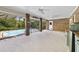 Covered brick patio with outdoor kitchen space and ceiling fans offers a relaxing space for entertaining at 428 N Pine Meadow Dr, Debary, FL 32713