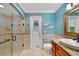 Bathroom featuring a tiled shower, granite countertop vanity, and a door to the outside at 428 N Pine Meadow Dr, Debary, FL 32713