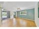 Bedroom featuring wood floors, large windows, and sliding glass doors to an outdoor area at 428 N Pine Meadow Dr, Debary, FL 32713