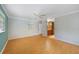 Bedroom with wood floors, ceiling fan, neutral walls and an en suite bathroom at 428 N Pine Meadow Dr, Debary, FL 32713