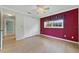 Cozy bedroom boasts hardwood floors, large closet, and natural light at 428 N Pine Meadow Dr, Debary, FL 32713