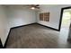 An empty bedroom featuring tile floors, a ceiling fan, and natural light at 4534 Lemans Dr, Orlando, FL 32808