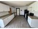 Bright, updated kitchen with new cabinets, granite countertops, and tile flooring at 4534 Lemans Dr, Orlando, FL 32808
