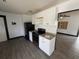 A view of the kitchen with new cabinets and stainless steel appliances at 4534 Lemans Dr, Orlando, FL 32808