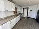 Modern kitchen with new cabinets, stainless steel appliances, and granite countertops at 4534 Lemans Dr, Orlando, FL 32808