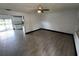 A large living room boasting tile floors, neutral paint, and abundant natural light at 4534 Lemans Dr, Orlando, FL 32808