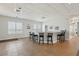Community bar area with a long counter and multiple chairs, great for entertaining at 4650 Links Village Dr # B103, Ponce Inlet, FL 32127