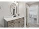 Contemporary bathroom vanity with quartz countertop and matte black fixtures at 4650 Links Village Dr # B103, Ponce Inlet, FL 32127