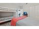 Comfortable bedroom with a bunk bed and a view to the living room at 4650 Links Village Dr # B103, Ponce Inlet, FL 32127