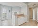 Charming breakfast nook with a counter, white cabinets, and easy access to the outside, perfect for casual dining at 4650 Links Village Dr # B103, Ponce Inlet, FL 32127