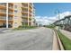 Exterior of residential building with manicured landscaping and street view at 4650 Links Village Dr # B103, Ponce Inlet, FL 32127