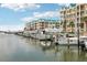 Waterfront condos with a marina view, showcasing the boat docks and lifts at 4650 Links Village Dr # B103, Ponce Inlet, FL 32127