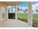 Spacious back patio overlooking lush green landscape at 4650 Links Village Dr # B103, Ponce Inlet, FL 32127