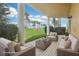 Inviting covered patio with comfortable seating and golf course views at 4650 Links Village Dr # B103, Ponce Inlet, FL 32127