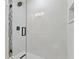 Modern bathroom shower with sleek glass door and rain shower head at 4650 Links Village Dr # B103, Ponce Inlet, FL 32127