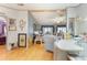 Open-concept living area with hardwood floors, comfortable seating, and a view into the adjacent living room at 5305 Ingleside, Leesburg, FL 34748