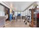 Large sunroom with plenty of seating, a TV, and natural light streaming through the many windows at 5305 Ingleside, Leesburg, FL 34748