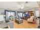 Inviting living room with hardwood floors, comfortable seating, and built-in shelving and television at 5305 Ingleside, Leesburg, FL 34748
