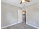 The bedroom features neutral walls and access to the kitchen at 603 Carver Dr, Lake Wales, FL 33853