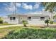 Well-maintained single-story home with a manicured lawn, shutters and updated paint at 603 Carver Dr, Lake Wales, FL 33853