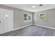 Bright living room showcasing gray wood-look floors and natural light at 603 Carver Dr, Lake Wales, FL 33853
