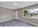 Bright living room showcasing gray wood-look floors, neutral walls and natural light at 603 Carver Dr, Lake Wales, FL 33853