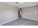 Spacious living room featuring gray wood-look floors and neutral walls at 603 Carver Dr, Lake Wales, FL 33853