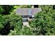 Aerial view of a home surrounded by lush greenery and mature trees, offering privacy at 625 Woodlawn Cemetery Rd, Gotha, FL 34734
